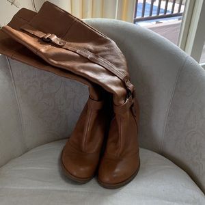 Nine west light brown/tan boots with rubber sole Gently worn. Good condition.